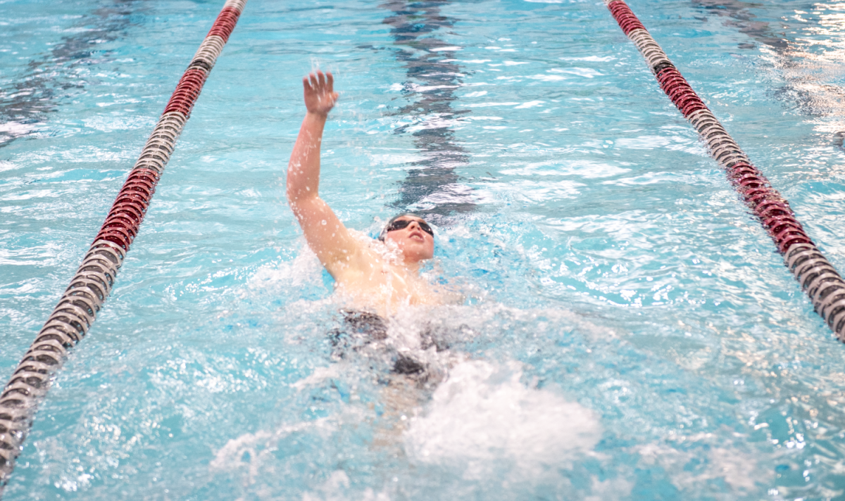 2.1.25 Senior Will Zink swimming backstroke in the 200 IM at Missoula. 